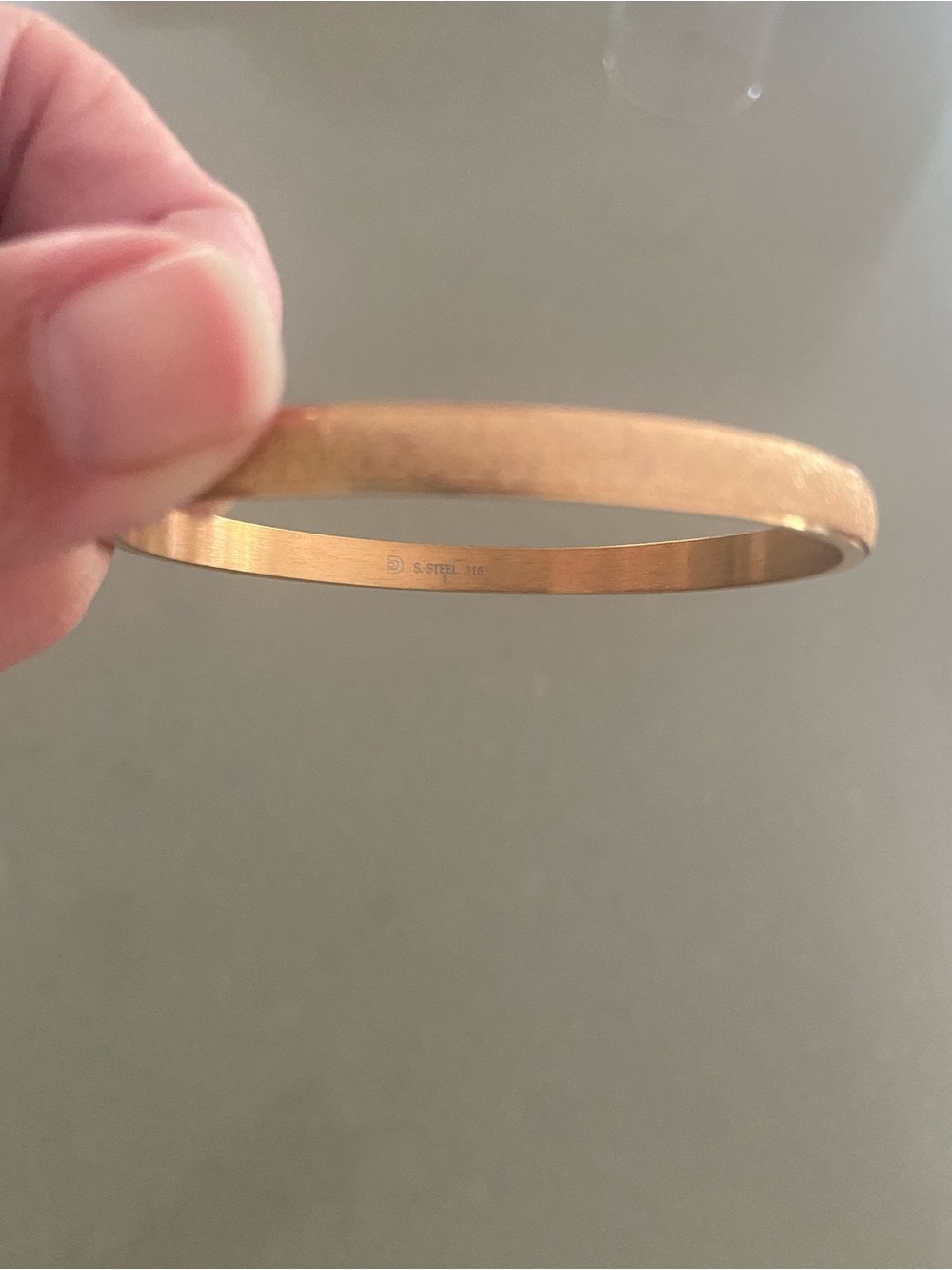Good tone marked S Steel 316  fancy finish bangle .